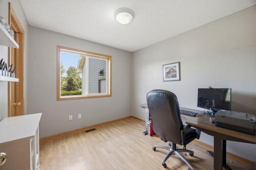 The main floor bedroom/office. There are 5 total bedrooms in the home, including this one.