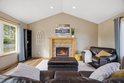 Grab your favorite book and cozy up next to the gas fireplace in this comfortable living room! Fireplace virtually enhanced.