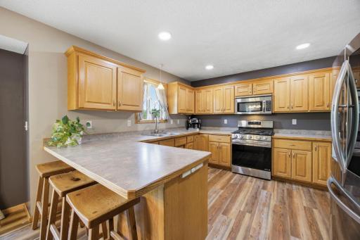 The kitchen features recessed lighting, a kitchen window overlooking the backyard and an extension to the countertop for quick meals. The cabinets in the kitchen are tremendous for functional living.