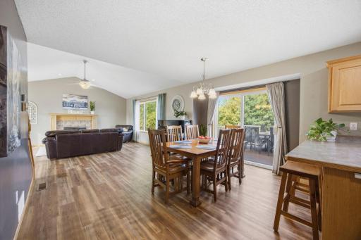 Enjoy eating a meal together in this informal dining space or grab a quick meal at the breakfast bar area! Note the easy access to the maintenance free deck through the sliding doors.