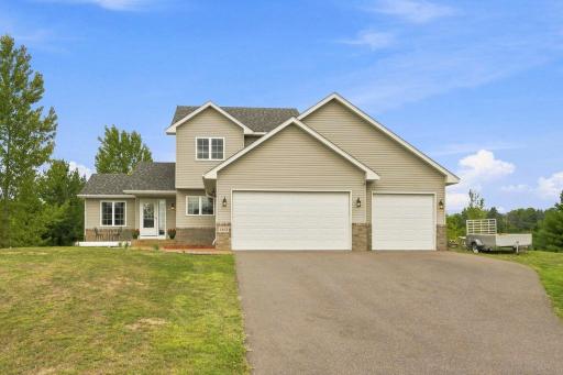 This modified two story home offers an insulated 3-car garage for day-to-day use and the attic above offers extensive shelving for exceptional storage.