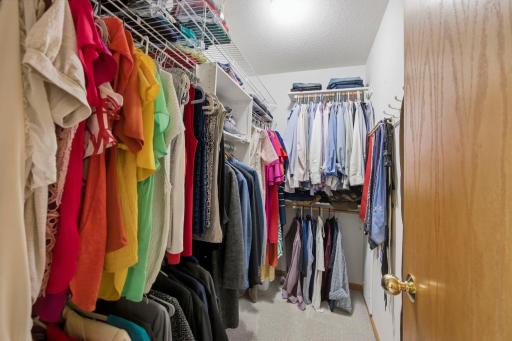 The primary bedroom walk-in closet is thoughtfully designed for organization and convenience.