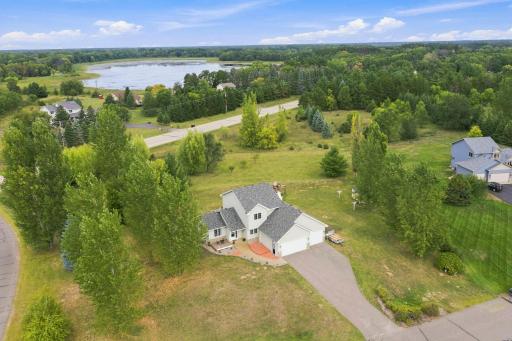 Welcome to 4493 194th Avenue NE in East Bethel set on over 2 acres of peaceful partially wooded land!