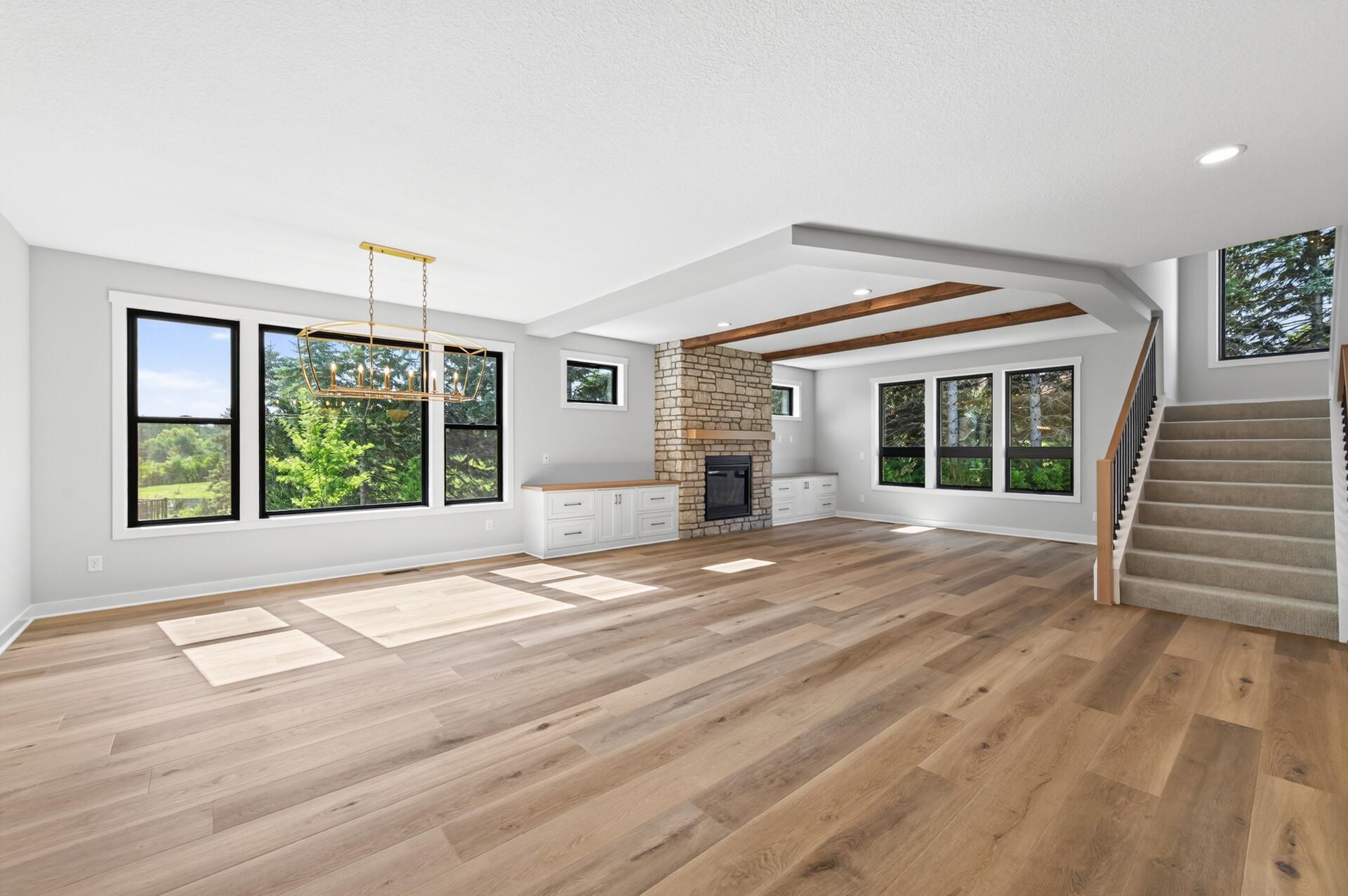 Open concept kitchen, dining, and living room areas