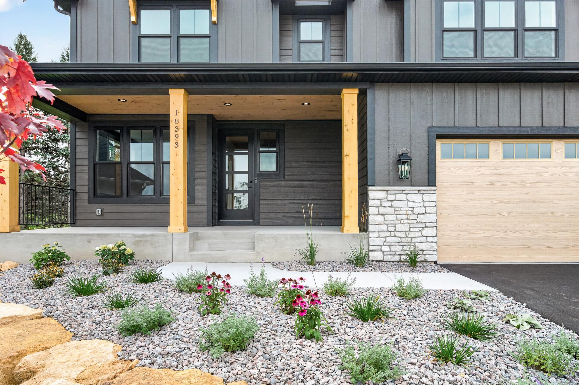 Beautiful rock landscaping and lovely plants throughout!