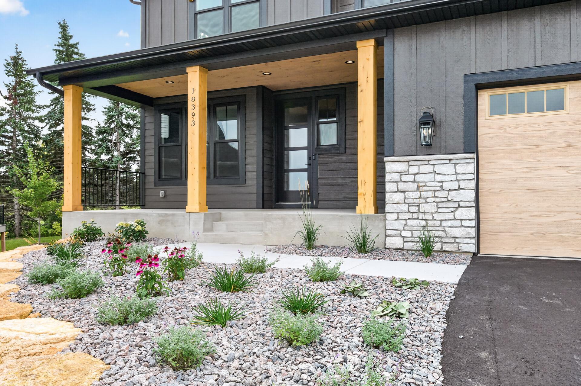 The front door offers cedar ceiling and columns - such a beautiful accent color!