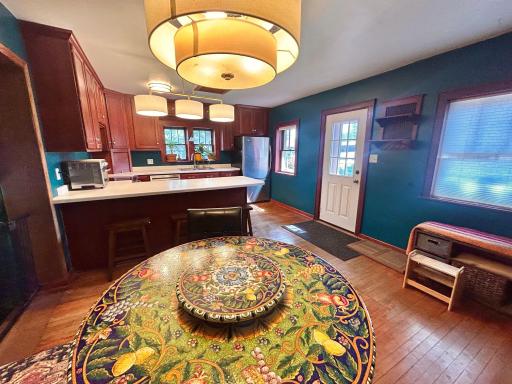 This is the dining area that seats many around your table! The door leads to deck and back yard.