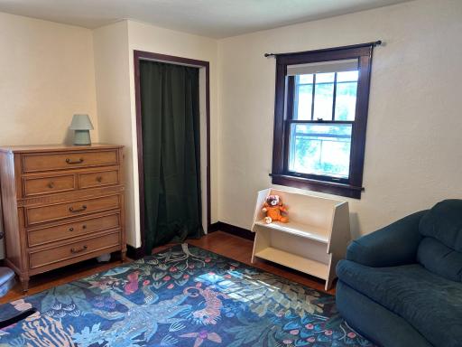 This room is on the main floor and is used as a bedroom currently. It could also be an office or a den.