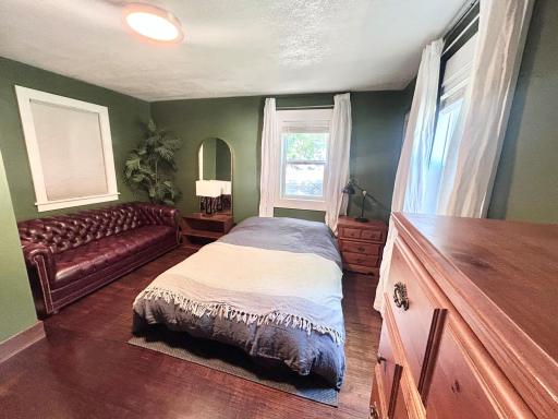 Main floor primary bedroom with sitting area.
