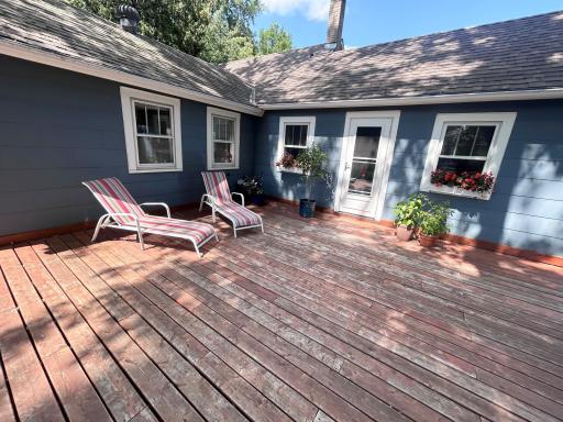 You will spend lots of time with your family and guests on the spacious deck. The door leads into the kitchen.