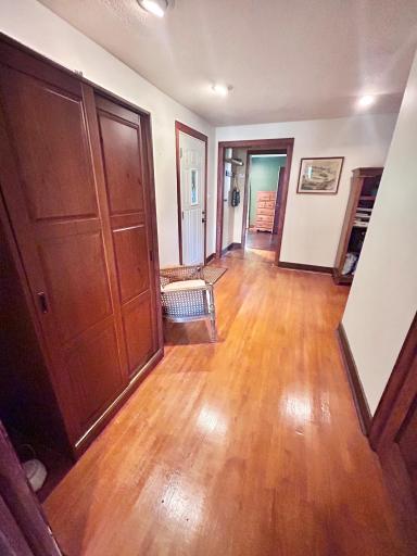 The spacious entryway. The current owners added thier own armoire as a coat closet.