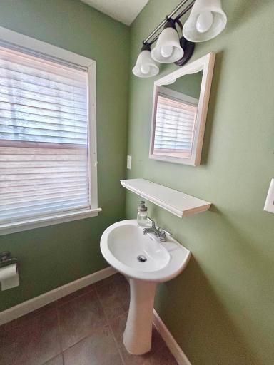 Pedestal sink, shelf and medicine cabinet in second bathroom. Dont forget the heated tile flooring!