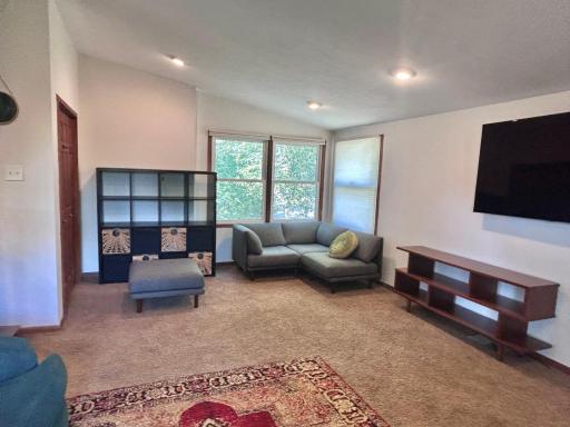 Here is the other half of the family room. Closet on the wall to the right side of this photo.