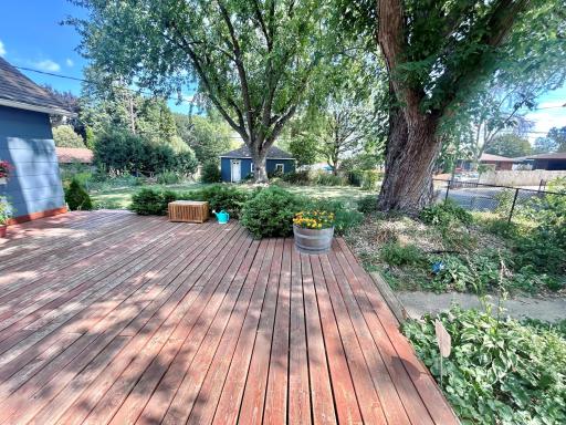 Looking from the deck at the side of the garage and back yard.