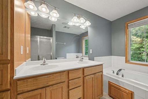 Primary bathroom with dual vanity and separate tub/shower
