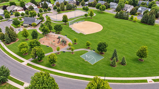 Peter Thompson park at the center of the community. Ball fields, a playground, sidewalks for daily walks, and more