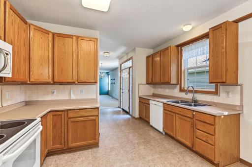 Bright kitchen with an abundance of oak cabinetry.