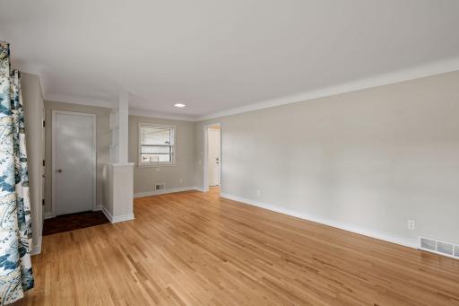 Sometimes used for a dining space, this area off the kitchen yet in the living room is versitie