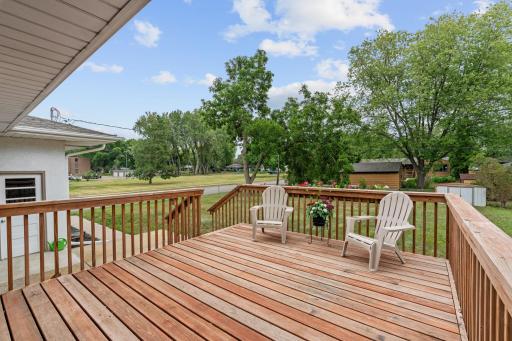 Spacious cedar deck walks out from home through sliding glass doors just off kitchen.