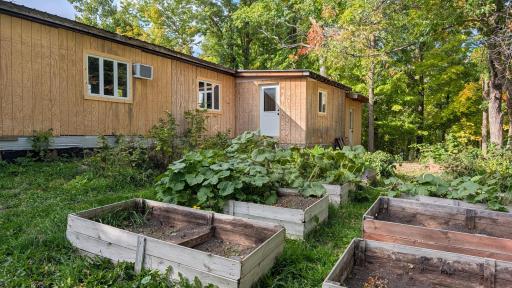 2BR 1 BA mobile complete with Raised garden beds, metal roof and 2 additions
