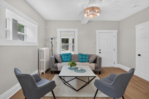 Living room with new LVP flooring and paint throughout