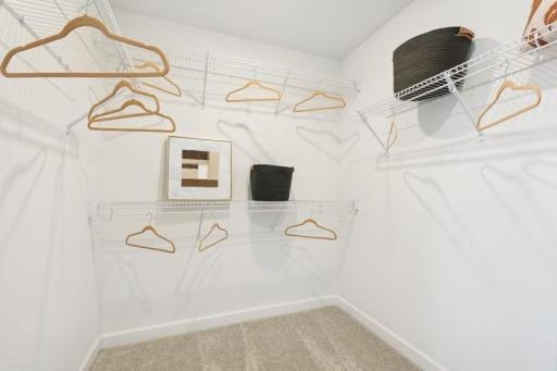 Generously sized owner’s walk-in closet offers abundant hanging and storage space for an organized, clutter-free retreat.