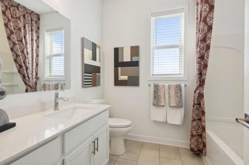 Full hall bath features a convenient tub/shower combination, stylish finishes, and a spacious vanity with plenty of storage.