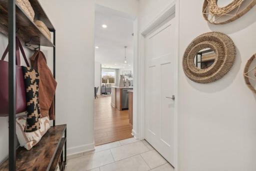 Convenient mudroom off the garage features a spacious walk-in closet, providing exceptional storage for coats, shoes, seasonal items, and everyday essentials.