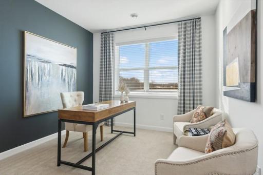 This versatile third bedroom features a closet and abundant natural light, making it equally well suited as a private home office, study, or guest room.