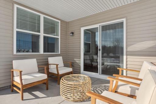 Enjoy outdoor living rain or shine on the private covered patio, conveniently accessed through sliding glass doors from the main living area.