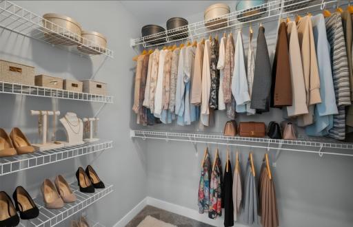 Virtual staged Primary walk-in closet #1