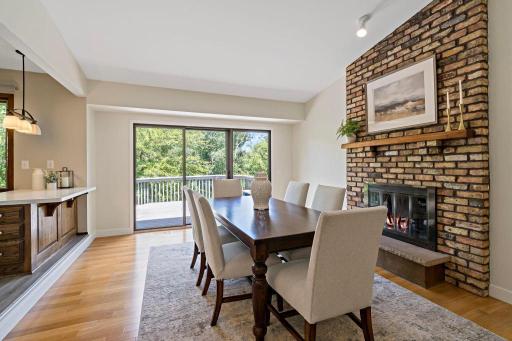 Enjoy the wood burning fireplace with floor to ceiling brick surround and access to the deck that has pond views.
