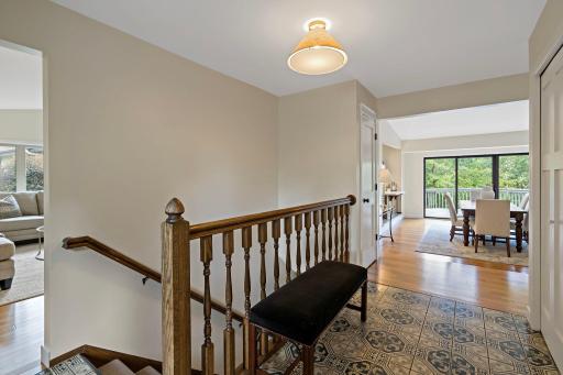 Step into the entryway with beautiful tile flooring and views out the back to the pond