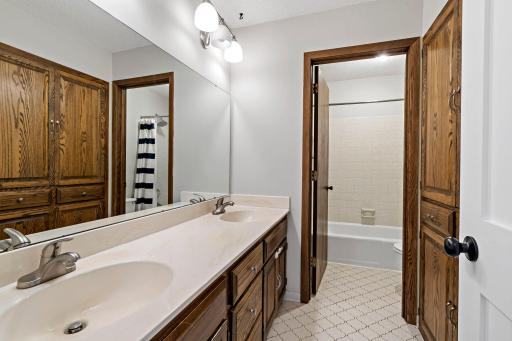 Main floor full bathroom in the hallway between bedrooms