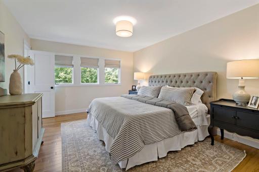 Main floor primary bedroom with closet space and en-suite 3/4 bathroom