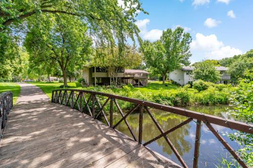 The home sits on a private pond with trails