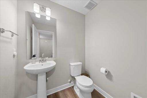 1/2 bath conveniently located on the ground level just off the foyer.