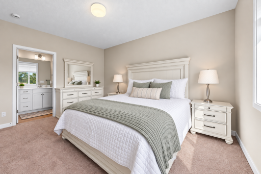 Spacious primary bedroom with private ensuite bath