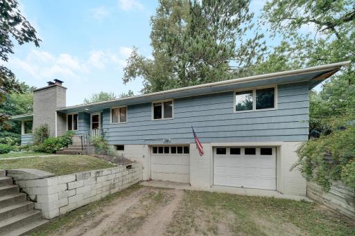 Driveway access to tuckunder oversized 2 car garage.