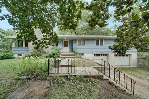 Private wooded lot with many amenities including 2nd 2 car garage, chicken coop area, children playhouse, firepit area, swing set, garden area and many plantings.