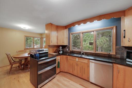 Kitchen looking into separate eating area.