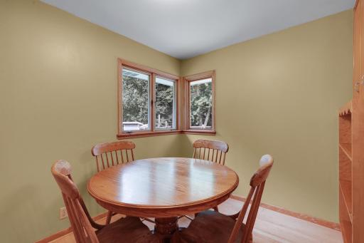 Separate eating area overlooking yard and play area.