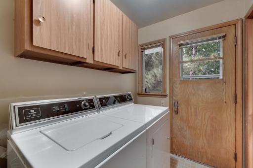 Main floor laundry room with rear access to rear yard.