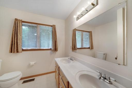 Full bath with double vanities for use of other 3 bedrooms.