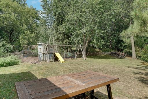 Firepit, swingset and chicken coop.