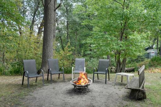 Great firepit area back in the wooded area on west side of lot.