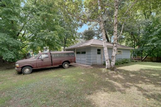 2 car detached garage on the south end of lot. Behind garage is a garden area.