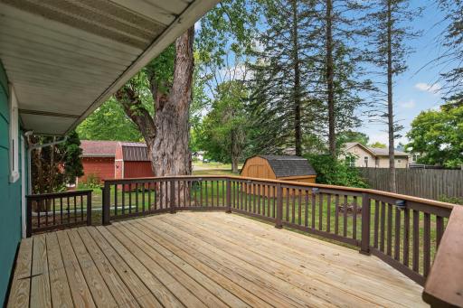 The deck does have a trap door for access from the downstairs egress window in the 3rd bedroom.