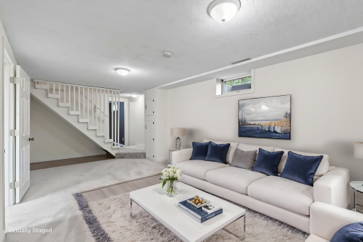 This view of the lower level family room shows the additional area where you can add a table or desk.