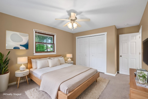 A different view of the primary bedroom showing the large closet.